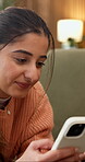Scroll, message and woman with phone in lounge, networking or communication with contact on website. Happy person, home and chat on social media, internet connection and online dating on mobile app