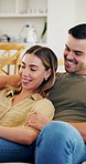 Relax, home and happy couple on sofa for entertainment, online streaming or subscription together. Man, woman and hug with smile on living room couch for movie, series or watching show in house