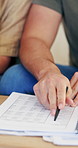 Documents, hands and couple on sofa in discussion for monthly bills, checklist or budget in living room. Home, finance paperwork and woman with man for tax review, accounting or asset management