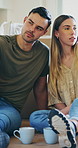 Relax, moving and couple with coffee in new house for property investment, discussion and renting. Pointing, real estate and homeowner with man and woman in living room for support, bonding and love