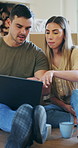 Moving, planning or couple with laptop in new home, remodeling idea or online shopping for furniture. Pointing, ecommerce or people with property renovation for upgrade, pc or interior design chat