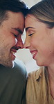 Happy, nose and couple with kiss in home for love, affection or romantic bonding together. Man, woman or forehead touch with smile, comfort or commitment for connection, embrace or marriage in house