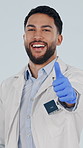 Face, doctor and man in studio with thumbs up, arms crossed and satisfaction for medical assurance, Happy, person and healthcare worker with like emoji, confidence and success on white background.
