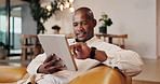 Man, smile and relax with tablet in home, browsing and streaming movies with subscription on website. Black person, online and watching film with tech, scroll and happy with entertainment in lounge