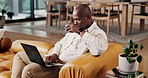 Black man, coffee and remote work in home with laptop, research and proofreading for copywriting. Journalist, beverage and freelancer at house with pc, editing article and email for story publication