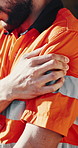 Injury, outdoor and man with shoulder pain at construction site for accident, overworked and stress. Engineering, contractor and hands of person massage for muscle strain, fibromyalgia and pressure