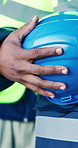 Building, hands and man with helmet for construction, planning and blueprint for engineering career. Architecture, closeup and person with ppe for safety compliance, renovation and infrastructure