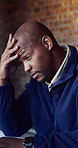 Stress, black man and architecture with typing on laptop in desk for building ideas and headache. Pain, engineering and person with migraine, technology and email for bankruptcy and negative feedback
