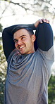 Fitness, man and talk with stretching at park to start exercise, muscle preparation or instructor. Bokeh, athlete or trainer with arm warm up outdoor for morning cardio, getting ready or conversation