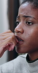 Upset, depression and black woman in home with bad news, breakup or anxiety attack in living room. Mental health, sad and African female person with disappointment, frustration or overwhelmed.