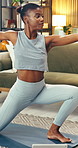 Yoga, girl and stretching with tablet in living room for online class, spinal health or fitness. Yogi, black woman and tiger pose in house for virtual lesson, wellness subscription and core strength