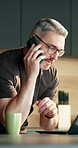 Man, laptop and remote work in house with phone call, glasses and conversation for project planning. Mature person, discussion and contact in home with tech, feedback and advice for freelance job.