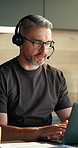 Man, laptop and virtual assistant in home with remote work, discussion and admin for customer service. Mature person, typing and freelance administrator talk with computer, contact or client support.