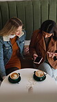 Phone, typing and above with friends in coffee shop for social media, bonding and reunion. Online restaurant rating, scroll and relax with women and tech in cafe for communication and customer review