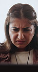 Confused, thinking and woman with laptop for remote work glitch, problem solving or venue doubt. Freelance event planner, earphones and person reading at home with tech error, issue or vendor mistake