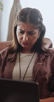 Confused, thinking and freelance woman with laptop glitch, problem solving and venue doubt. Event planner, remote work and person reading at home with earphones, tech error and vendor mistake