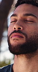 Fitness, man and deep breath on break outdoor for health, thinking or mindfulness with peace. Athlete, person or rest with fresh air for calm reflection, zen or wellness with  exercise recovery