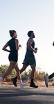 Friends, running or exercise in road with nature, training together or teamwork for wellness journey. Sports, people and runner outdoor with cardio workout, endurance challenge or fitness performance