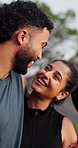 Athlete, couple and laugh outdoor for fitness, support and bonding together for exercise break. Smile, people or talking in nature with embrace, funny joke and sightseeing view for sports destination