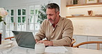 Documents, remote work and man with laptop in home for finance report with tax planning. Paperwork, typing and mature financial advisor with freelance career for investment advice in kitchen at house