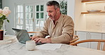 Documents, laptop and man in kitchen at house with pro bono case for legal settlement with contract. Technology, typing and mature attorney with remote work for law project with research in home.