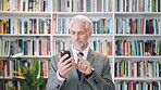 History, phone and search with man in library for archives, book collection or research. App, information and scrolling with mature historian in bookstore for fact finding or verification on mobile