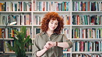 Bookshelf, education and time with student woman in library for development, learning or research. College, university and watch with person on campus for information, knowledge or scholarship
