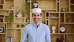 Muslim man, face and kufi with smile in office with pride, career and confidence at company. Islamic person, traditional hat and fez with religion, faith or startup at creative agency in Saudi Arabia