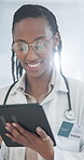 Doctor, research or black woman with tablet for medical analysis, good news or information in clinic. Female person, healthcare worker or smile with technology for health app or service in hospital