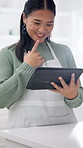 Cooking, happy and Asian woman on tablet for recipe, online instruction and meal tutorial. Home, kitchen and person on tech for research, lunch ideas and inspiration on culinary website or food blog