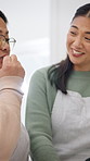 Cooking, senior mother and woman with tablet in kitchen, bonding and searching for recipe on website. Online, mature person and talking to daughter with tech, laugh and learn culinary skills in house