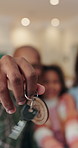 Keys, love and hands of family in new home for real estate, bonding or property investment. Happy, mortgage and child with parents for milestone with house purchase together for connection on weekend