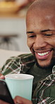 Happy, coffee and black man with phone in home for social media, online chatting or texting. Male person, user or communication with mobile smartphone or beverage on sofa for network or connection
