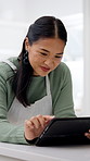 Cooking, research and Asian woman on tablet for recipe, online instruction and meal tutorial in kitchen. Home, tech and person with lunch ideas, inspiration and culinary website for dinner guide