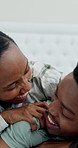 Cuddle, laughing and black couple in bed for morning, bonding and relax together on weekend. Home, happy and man with woman in bedroom for connection, funny conversation and playful relationship
