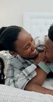Marriage, laughing and black couple in bed for morning, bonding and relax together on weekend. Home, happy and man with woman in bedroom for connection, funny conversation and playful relationship