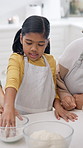 Flour, family and child with baking in home for teaching recipe, culinary skills or instructions. Grandmother, mother and girl with ingredient preparation for dessert, development support and bonding