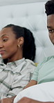 Couple, home and man with laptop on bed, remote work and editing blog post on social media or online. Creative, black people and freelance project in bedroom, writer and typing article on website