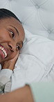Morning, laugh and couple in bed for conversation, bonding and affection on weekend together. Marriage, happy and man with woman in bedroom for talking, connection and relax for relationship in home