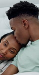 Couple, kiss and bonding in bedroom, remote work and editing blog post on social media app or online. Black people, affection and writer with laptop on bed, creative and typing article on web in home