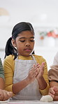 Child, flour and baking in home with dough, learning and culinary skills for homemade dessert. People, family and teaching kid in kitchen with wheat, pastry recipe and supervision for handmade break