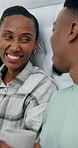 Talking, love and black couple in bed with coffee, conversation and bonding on weekend morning. Bedroom, happy and man with woman with drink for speaking, connection and chat for marriage in home