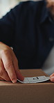 Shipping, hands or man with package sticker for delivery info, packing process or cargo details. Supply chain, small business and person with box label for courier service, distribution and logistics