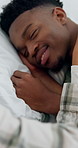 Love, wake up and black couple excited in bed for happy, communication and sleeping in home. Smile, marriage and man with woman in bedroom for weekend morning with relax and playful partnership