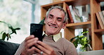 Phone, relax and smile with old man on sofa in living room of home for browsing or reading. App, communication and text message with happy senior at apartment for download, scrolling or social media