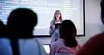 Coding, screen and businesswoman in office with presentation at meeting for software program. Tablet, discussion and mature female developer with crowd at seminar for website development in workplace