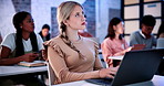 Woman, laptop and typing in classroom at college for notes, review and problem solving with education. Girl, computer and students with attention for learning, scholarship and thinking at university