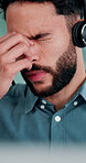 Stress, headset and businessman in office with headache for contact us, call center or help desk. Migraine, crm and male technical support consultant with brain fog for customer service in workplace.