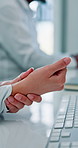 Typing, keyboard and businesswoman in office with wrist pain, injury or fracture for finance report. Technology, arthritis and financial manager with muscle sprain, osteoporosis or carpal tunnel,
