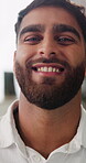 Wellness, face and happy man with unwind, positive attitude and optimism on weekend break. Day off, laugh and male person with portrait, confidence and wellbeing satisfaction in Los Angeles.